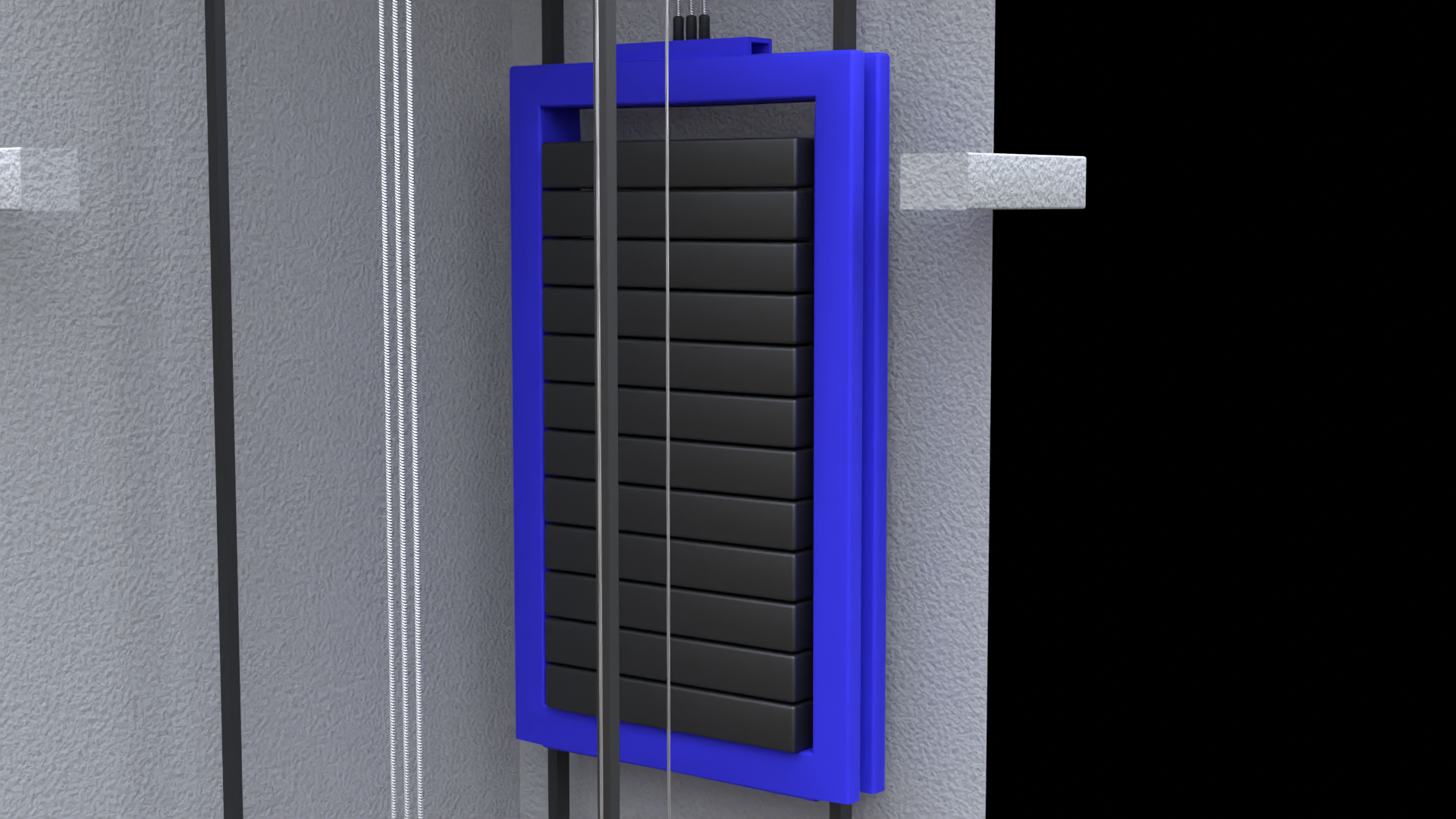 Grafika przedstawia płaski pionowy prostopadłościan, na którego składa się kilka poziomych prostopadłościennych bloczków, będących odważnikami. Opisany element sunie po prowadnicach i od góry przyłączone są do niego trzy stalowe linki.