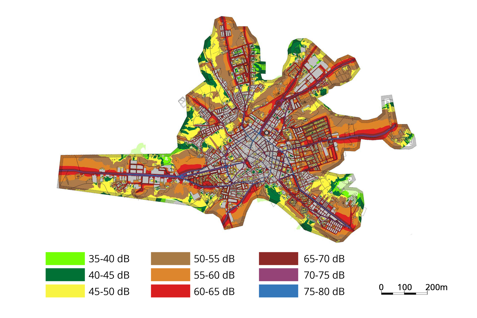 Fotografia przedstawia fragment planu miasta. Pod nim podziałka i kolorowa skala natężenia dźwięku w decybelach. Na planie miasta naniesiono barwy skali. Wysokie natężenie hałasu zaznaczono na przykład przy ciągach komunikacyjnych. Powstała mapa akustyczna miasta.