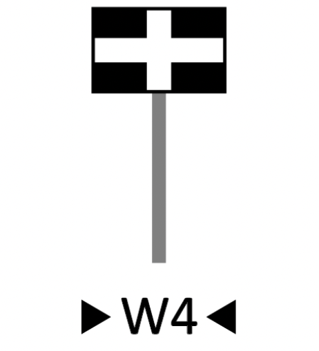 Wskaźnik wu cztery. Prostokąt o dłuższym poziomym boku osadzony na słupku. Prostokąt jest czarny, a na nim naniesiono poziomy i pionowy biały pas. Pasy są szerokie i dzielą wnętrze na cztery równe części.