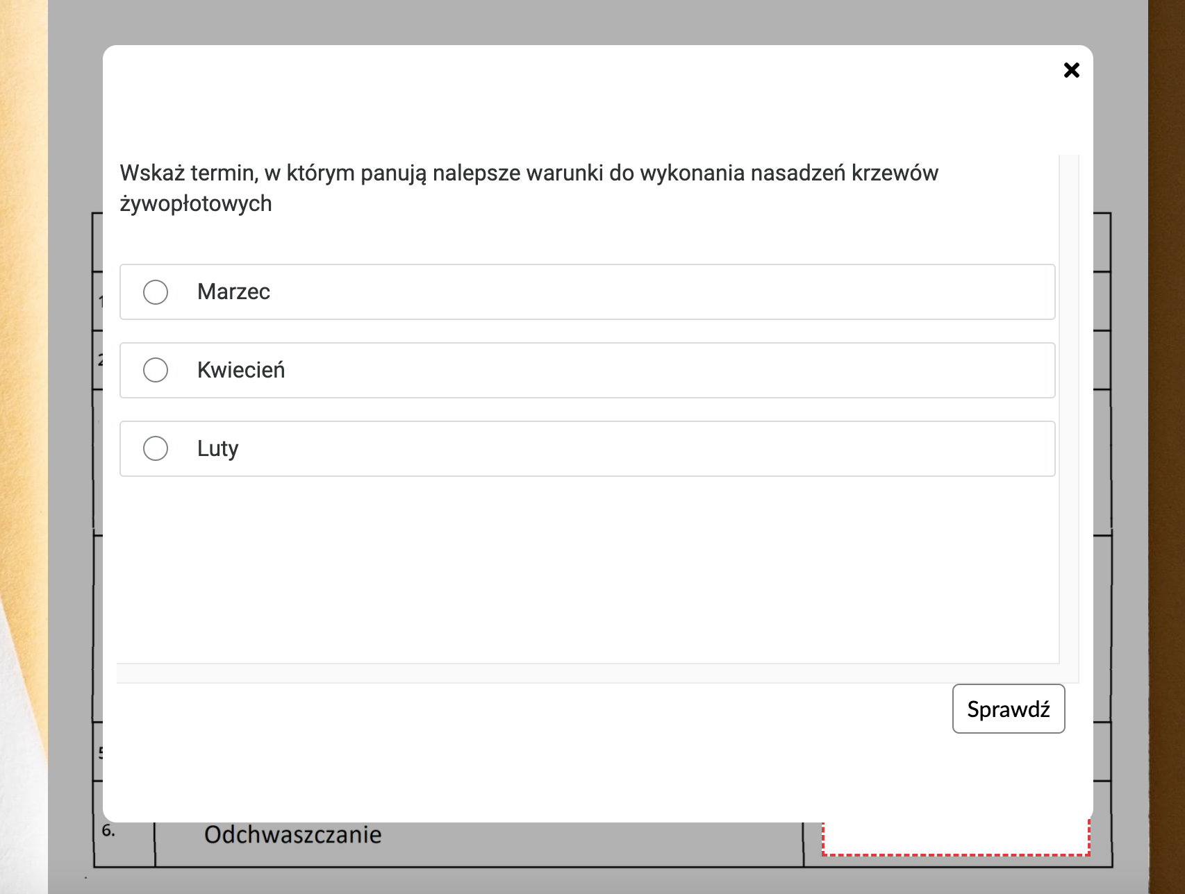 Ekran z zadaniem ćwiczeniowym i przyciskiem „Sprawdź”