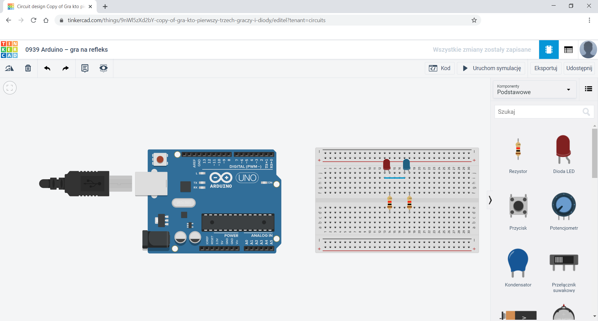 Na zrzucie ekranu widoczne jest środowisko Tinkercad. W oknie głównym znajduje się płytka stykowa oraz moduł arduino UNO.  Na płytce stykowej znajduje się niebieska i czerwona dioda, które połączone są katodami.  Natomiast anody diod połączone są z rezystorami 1 kΩ.  