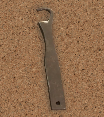 Zdjęcie przedstawia metalowy wyginacz. Składa się on z rękojeści i haczykowatej końcówki. 
