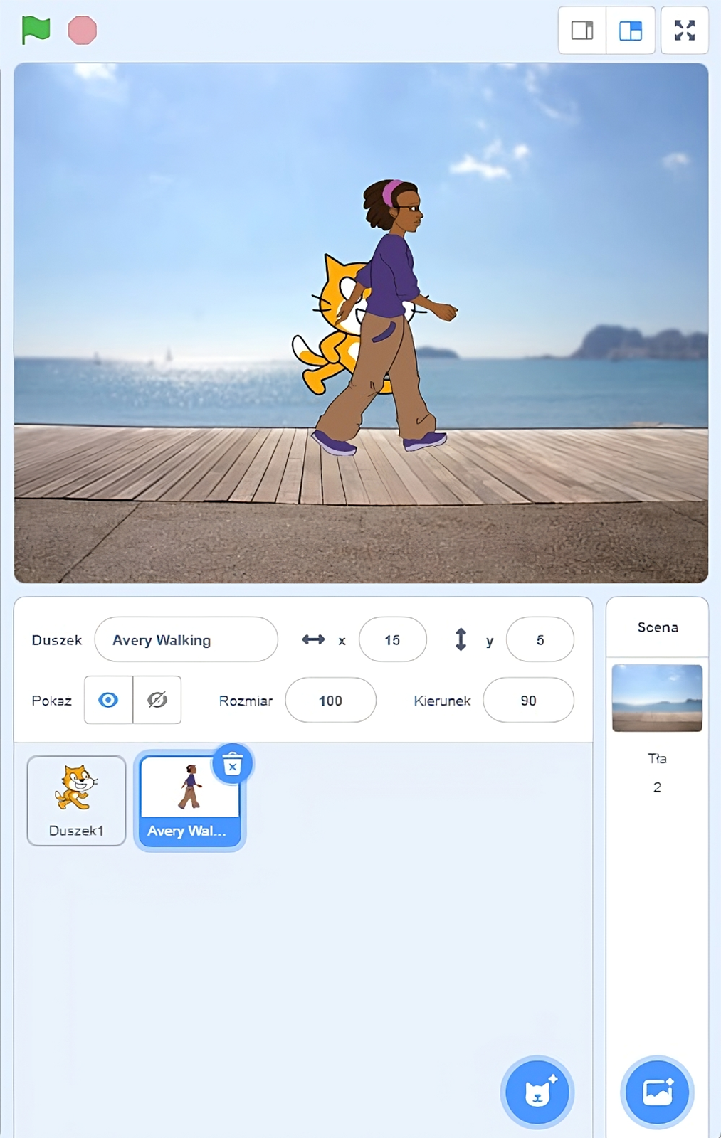 Na zdjęciu widać wizualizację dodatkowej sceny ze zmienionym tłem. W górnym oknie znajduje się duszek w formie animowanego kota, który idzie po drewnianej promenadzie. Równolegle z nim idzie dziewczynka słuchająca muzyki. Dziewczyna ma ciemną karnację. Dziewczyna ubrana jest w fioletową bluzę i beżowe spodnie. Promenada jest obok zbiornika wodnego. W tle zdjęcia znajduje się niebo oraz słońce.W drugim oknie znajdują się pola z nazwami zmiennych i przypisanymi wartościami. Przykładowo. Zmienna: duszek, wartość: Avery Walking. Zmienna X: wartość piętnaście, zmienna y: wartość pięć, zmienna pokaż: obok przyciski z symbolem oka oraz przekreślonego oka, zmienna rozmiar: sto, kierunek: dziewięćdziesiąt. Niżej znajduje się miniaturka z duszkiem przypominającym kota oraz miniaturka z idącą dziewczynką. Miniatura z dziewczynką jest zaznaczona.W prawym dolnym rogu widoczne jest okno ze zmienną scena. Pod zmienną widoczna jest miniaturka przedstawiająca drewnianą promenadę obok zbiornika wodnego. Pod miniaturą jest dodatkowa zmienna tła z wartością dwa. Po prawej znajduje się zmienna scena z miniaturą drewnianej promenady oraz napis: tło z cyfrą dwa.W prawym dolnym oknie aplikacji widocznych jest przycisk przedstawiający obrazek z gwiazdką w prawym górnym rogu. 