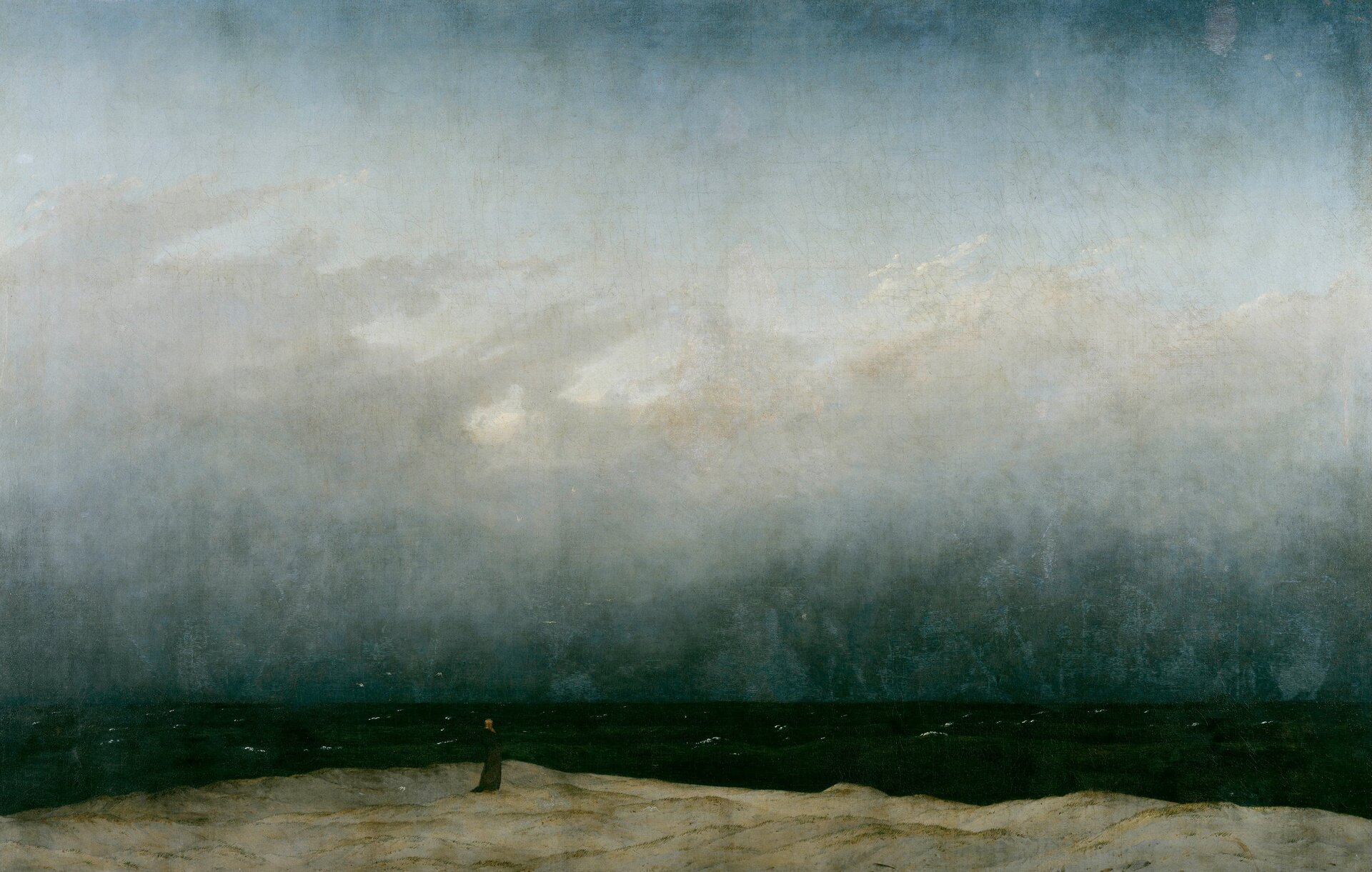 Ilustracja przedstawia obraz Caspara Davida Friedricha „Mnich nad brzegiem morza”. Obraz podzielony jest na trzy części: ziemię, morze i niebo. Nad brzegiem morza stoi mnich i wpatruje się w naturę. Otaczają go latające nisko mewy. Morze jest bardzo ciemne, a nad nim unoszą się szare chmury.