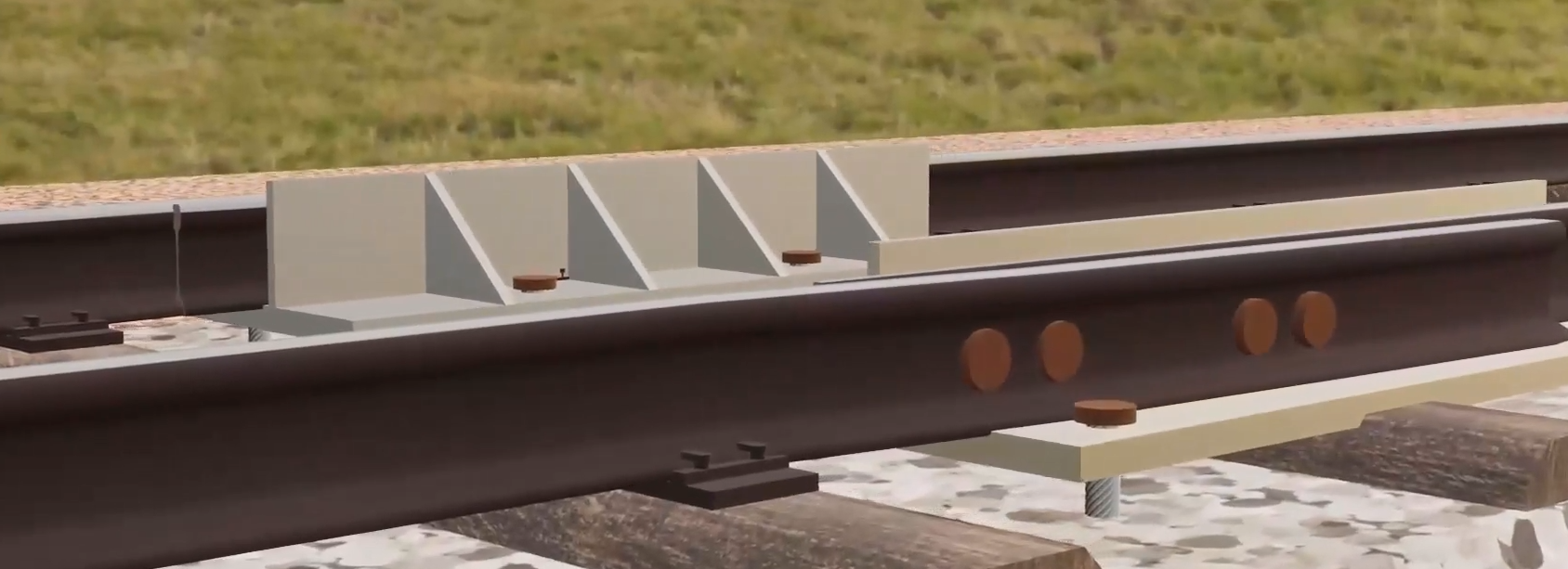 Ilustracja przedstawia szyny wyposażone w w urządzenia zapobiegające uszkodzeniom w wyniku wydłużeń termicznych.