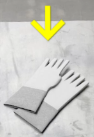 Ilustracja przedstawia przykładowy przedmiot ze strzałką wskazująca. Na blacie leży para dużych rękawiczek oraz strzałka nakierowana na rękawiczki. 