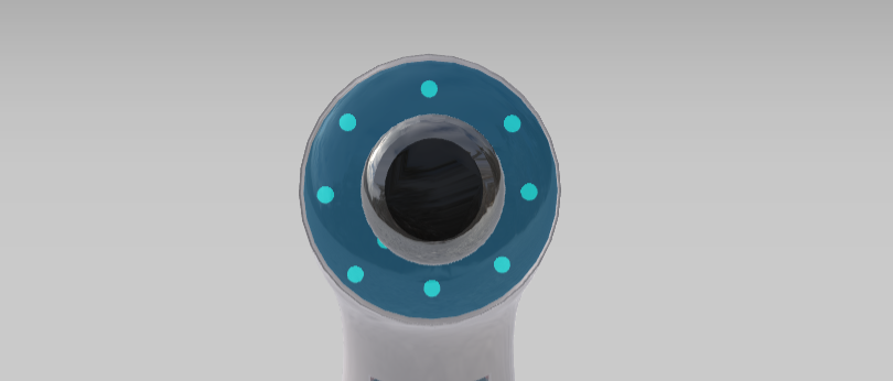 Grafika przedstawia głowicę urządzenia do mezoterapii bezigłowej. Głowica jest okrągła i znajdują się na niej niebieskie punkty.