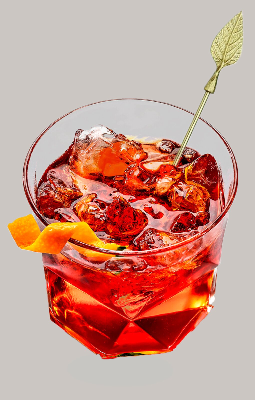 Zdjęcie przedstawia drink Negroni. Pod punktami interaktywnymi znajdują się nagrania audio prezentujące opis każdego drinka.