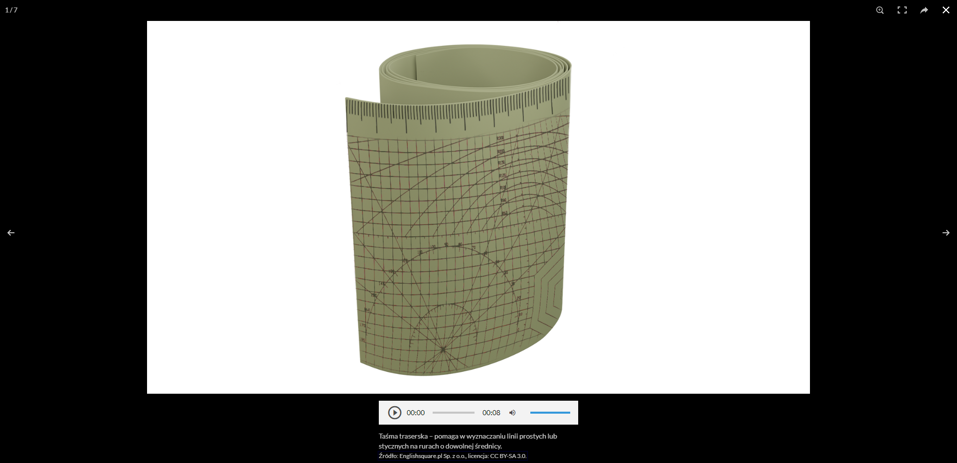 Ilustracja przedstawia przykładową grafikę taśmy traserskiej zwiniętej w rulon.