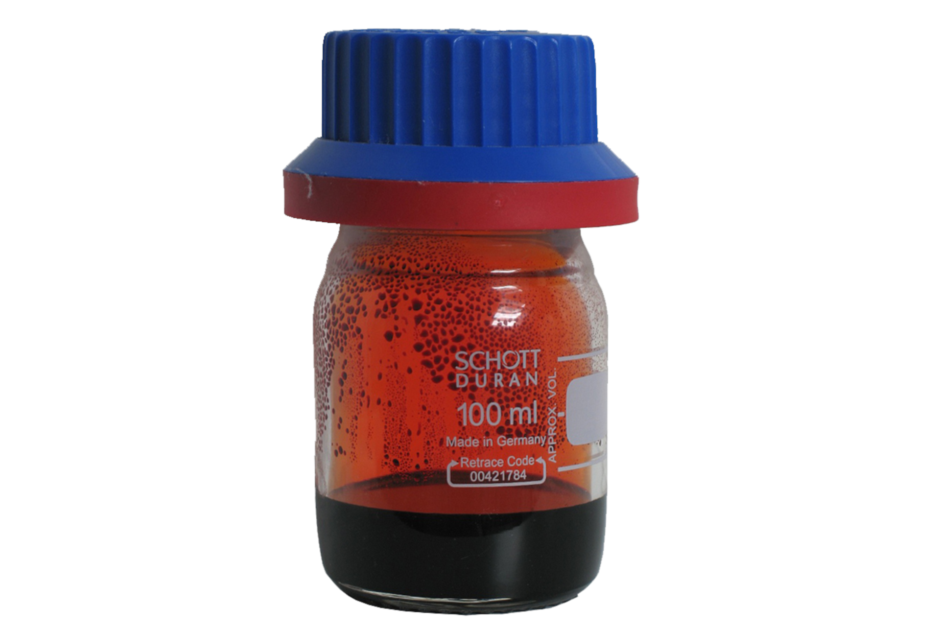 Na ilustracji ukazano zakręconą niebieską zakrętką buteleczkę, w której znajduje się ciemnoczerwona substancja.