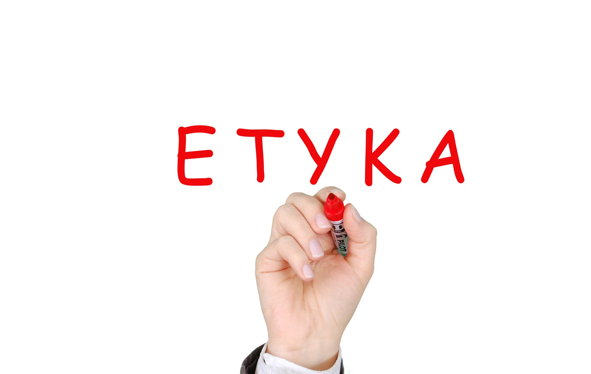 Kliknij żeby powiększyć Na ilustracji słowo "ETYKA" zapisane pisakiem oraz ręka trzymająca flamaster.