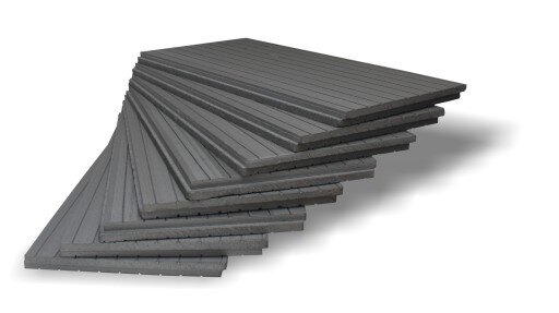 Zdjęcie przedstawia polistyren ekstrudowany. Widać kilka czarnych mat ułożonych jedna na drugiej.