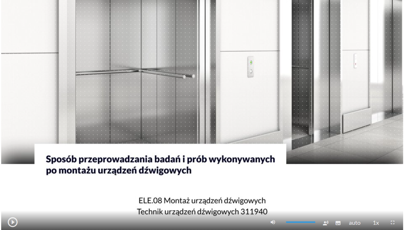 Ilustracja przedstawia przykładowy wygląd ekranu filmu.Widoczny korytarz na ścianie otwarte drzwi windy. Wewnątrz widoczna poręcz.