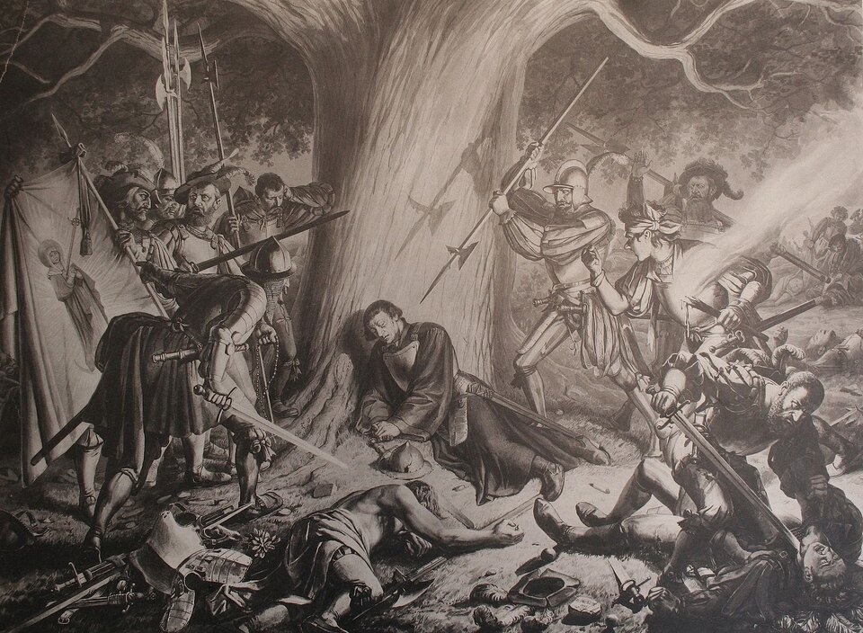 Ilustracja przedstawia mężczyznę w długich szatach, z mieczem przy boku, leżącego pod drzewem. Wokół niego widać grupę żołnierzy z mieczami i kopiami, wrogo nastawionych do mężczyzny. Jeden z żołnierzy celuje kopią w jego szyję, inny dobija leżącego na ziemi.