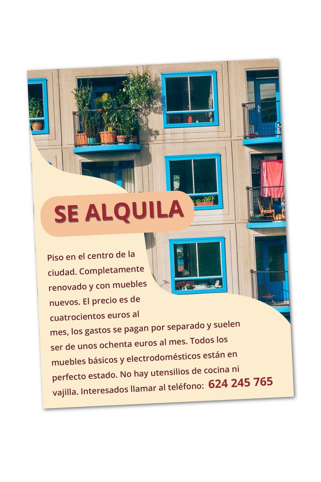 Ilustracja przedstawia ogłoszenie. Na tle bloku mieszkalnego znajduje się tekst: SE ALQUILA. Piso en el centro de la ciudad. Completamente renovado y con muebles nuevos. El precio es de cuatrocientos euros al mes, los gastos se pagan por separado y suelen ser de unos ochenta euros al mes. Todos los muebles básicos y electrodomésticos están en perfecto estado. No hay utensilios de cocina ni vajilla. Interesados llamar al teléfono: 624 245 765.