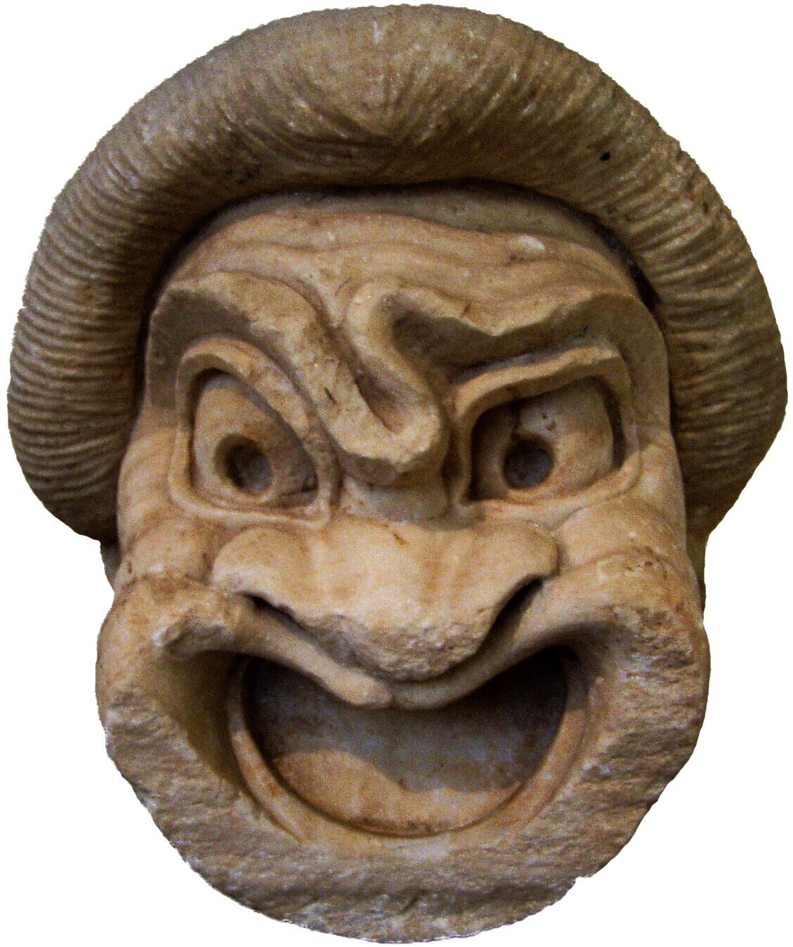 Zdjęcie przedstawia maskę w tragikomicznym grymasie. Wybałuszone oczy, zmarszczone czoło, szeroki nos, usta otwarte. Ta karykatura służyła jako maska w greckim teatrze. Nieodłączny element wystroju aktora.