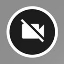 Zdjęcie przedstawia ikonę przejścia do pozycji wyjściowej modelu 3D. Składa się ona z przekreślonej białej kamery, która umieszczona jest w czarnym kole z białą obwódką.