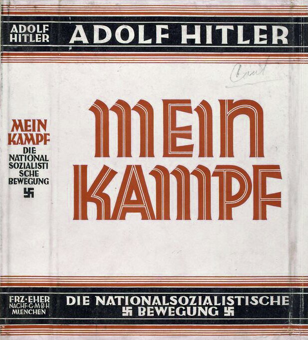 Zdjęcie przedstawia okładkę książki Mein Kampf Adolfa Hitlera, na której znajdują się małe swastyki.