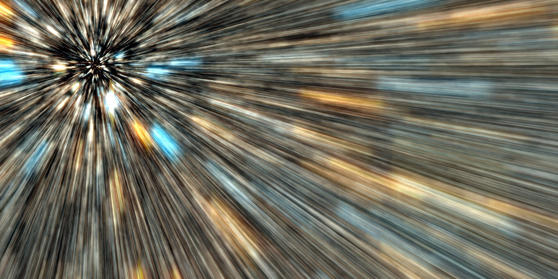 Zdjęcie będące artystyczną wizją hasła: szybkość światła. Są to promieniście rozchodzące się od punktu leżącego blisko lewego górnego rogu ilustracji. Ich kolory to przeważnie czarny, niebieski, pomarańczowy i biały, przy czym niebieskie i pomarańczowe części kresek sprawiają wrażenie podłużnych plam.