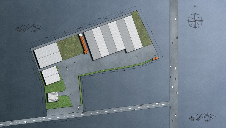 Na zdjęciu widać - w ujęciu z góry - plan w trakcie przygotowywania. Wytyczono dwie prostopadłe względem siebie drogi - jedną poziomą, drugą pionową, po prawej stronie. W połowie poziomej drogi przylega do niej szary plac w kształcie odwróconej o 90 stopni litery L. Na placu tym umieszczone zostały zielone i białe prostokąty, symbolizujące układ trawników i budynków.