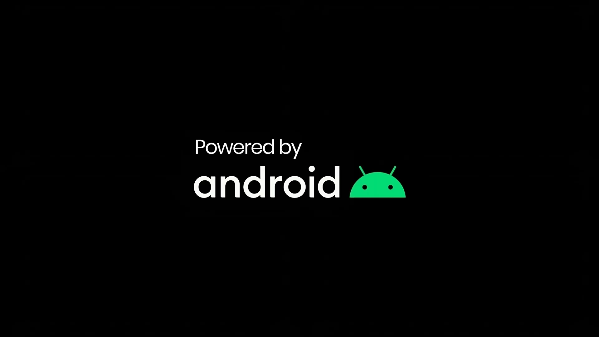 Na zdjęciu przedstawiono ekran powitalny dla Android.W centralnej części zdjęcia na czarnym tle znajduje się zielone logo Android. Po lewej stronie znajduje się napis po angielsku Powered by android, tłumaczenie to "zasilany przez Android".