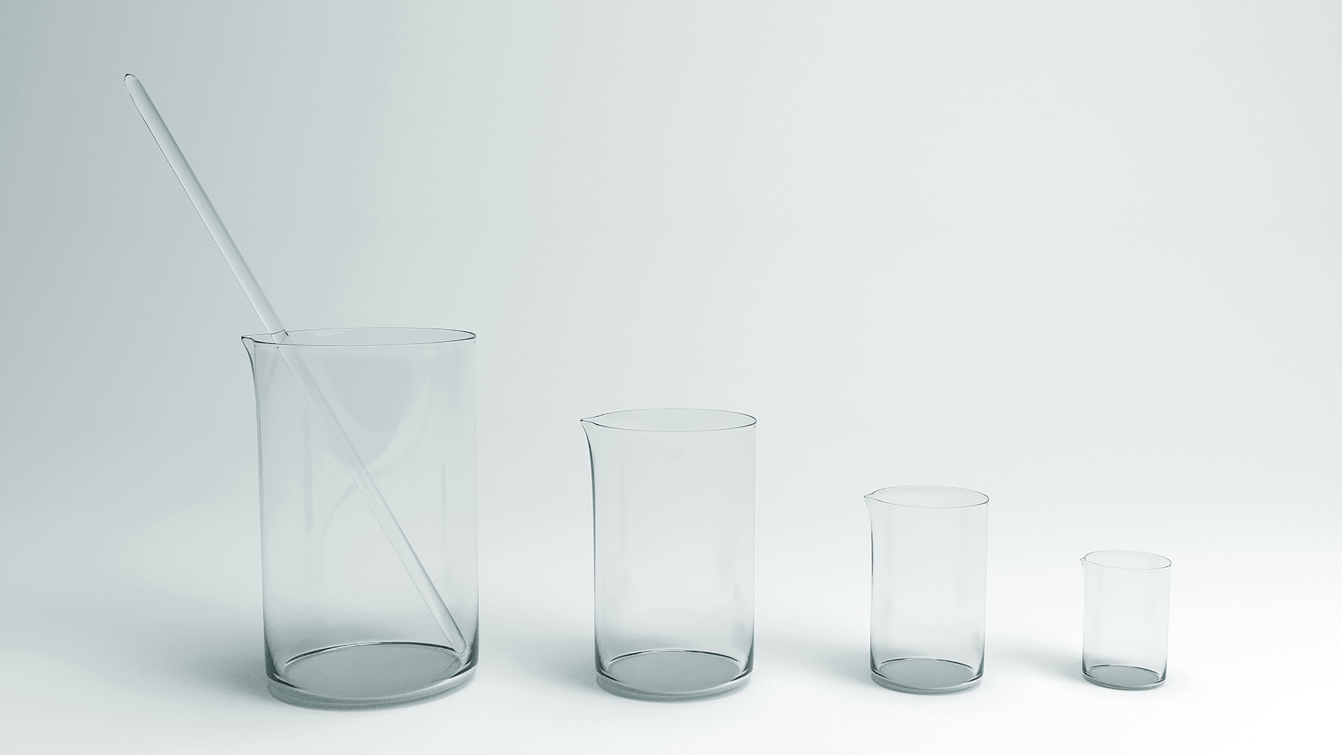 Zdjęcie przedstawia różnej wielkości szklane zlewki, ustawione od największej do najmniejszej. W największej zlewce znajduje się szklana bagietka.