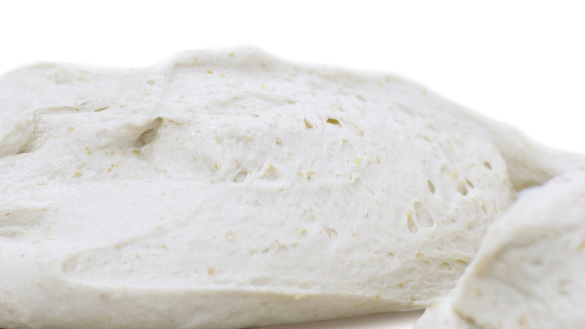 Zbliżenia przekroju kęsa ciasta mieszanego pokazujące strukturę w fazie rozrostu wstępnego