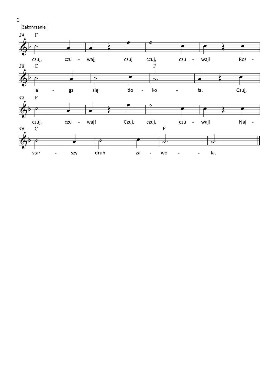 Grafika przedstawia partyturę utworu „Płonie ognisko w lesie”, który jest napisany w metrum trzy czwarte, w tonacji F‑dur. Partytura ma dwie strony, na których zapisano czterdzieści osiem taktów oraz przedtakt. Melodię zapisano w kluczu wiolinowym, a pod nutami zanotowano tekst, łącznie trzy zwrotki. Wszystkie dźwięki należą do oktaw razkreślnej lub dwukreślnej. To jest opis drugiej strony partytury.
W trzydziestym czwartym takcie na pierwszą miarę śpiewana jest ćwierćnuta a, na miarę drugą zapisano pauzę ćwierćnutową, natomiast na trzecią miarę wykonywana jest ćwierćnuta f. Nad taktem zapisano akord F‑dur. W takcie trzydziestym piątym na pierwsze dwie miary śpiewana jest półnuta f, a na miarę trzecią ćwierćnuta c. Nad taktem zapisano akord F‑dur. W trzydziestym szóstym takcie na pierwszą miarę śpiewana jest ćwierćnuta c, na miarę drugą zaznaczono pauzę ćwierćnutową, a na trzecią miarę ćwierćnutę c. Nad taktem zapisano akord F‑dur.
W trzydziestym siódmym takcie na pierwsze dwie miary śpiewana jest półnuta b, a na miarę trzecią ćwierćnuta a. Nad taktem zapisano akord C‑dur. W takcie trzydziestym ósmym na pierwsze dwie miary śpiewana jest półnuta b, a na miarę trzecią ćwierćnuta c. Nad taktem zapisano akord C‑dur. W trzydziestym dziewiątym takcie śpiewana jest półnuta z kropką a. Nad taktem zapisano akord F‑dur. W takcie czterdziestym na pierwszą miarę wykonywana jest ćwierćnuta a, na miarę drugą zapisano pauzę ćwierćnutową, a na trzecią miarę ćwierćnutę c. Nad taktem zapisano akord F‑dur.
W takcie czterdziestym pierwszym na pierwsze dwie miary śpiewana jest półnuta c, a na miarę trzecią ćwierćnuta a. Nad taktem zapisano akord F‑dur. W czterdziestym drugim takcie na pierwszą miarę śpiewana jest ćwierćnuta a, na miarę drugą zapisano pauzę ćwierćnutową, natomiast na trzecią miarę wykonywana jest ćwierćnuta f. Nad taktem zapisano akord F‑dur. W takcie czterdziestym trzecim na pierwsze dwie miary śpiewana jest półnuta f, a na miarę trzecią ćwierćnuta c. Nad taktem zapisano akord F‑dur. W czterdziestym czwartym takcie na pierwszą miarę śpiewana jest ćwierćnuta c, na miarę drugą zaznaczono pauzę ćwierćnutową, a na trzecią miarę ponownie ćwierćnutę c. Nad taktem zapisano akord F‑dur.
W czterdziestym piątym takcie na pierwsze dwie miary śpiewana jest półnuta b, a na miarę trzecią ćwierćnuta a. Nad taktem zapisano akord C‑dur. W takcie czterdziestym szóstym na pierwsze dwie miary śpiewana jest półnuta b, a na miarę trzecią ćwierćnuta c. Nad taktem zapisano akord C‑dur. W czterdziestym siódmym takcie śpiewana jest półnuta z kropką a. Nad taktem zapisano akord F‑dur. W takcie czterdziestym ósmym ponownie śpiewana jest półnuta z kropką a. Nad taktem zapisano akord F‑dur.