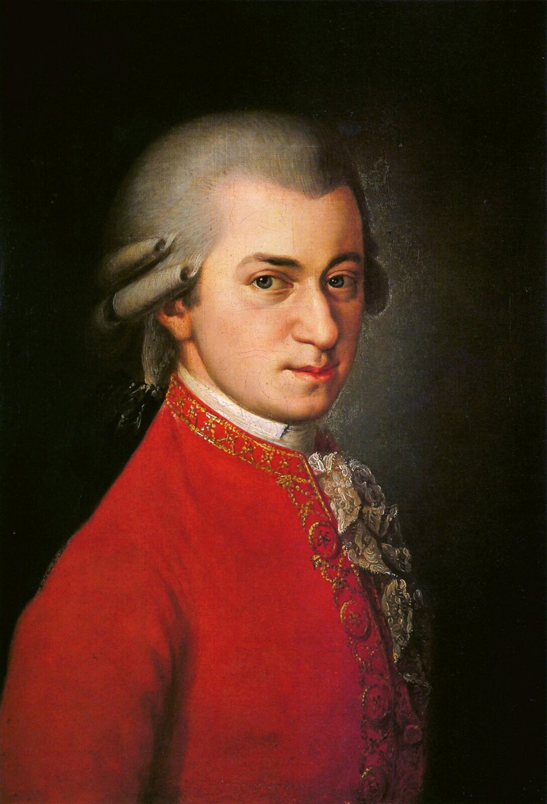Obraz przedstawiający portret kompozytora Wolfganga Amadeusza Mozarta. Dzieło zostało namalowane przez Barbarę Krafft. Na obrazie dość młody mężczyzna, raczej drobnej postury, twarz raczej pociągła, dość duży nos, wąskie usta, niebieskie oczy. Na głowie biała peruka, na wysokości ucha ułożone loki, z tyłu pozostałe włosy związane kokardą. Ubrany w białą koszulę z koronkowym żabotem i czerwony surdut. Tło obrazu: ciemne światło pada na połowę twarzy mężczyzny.