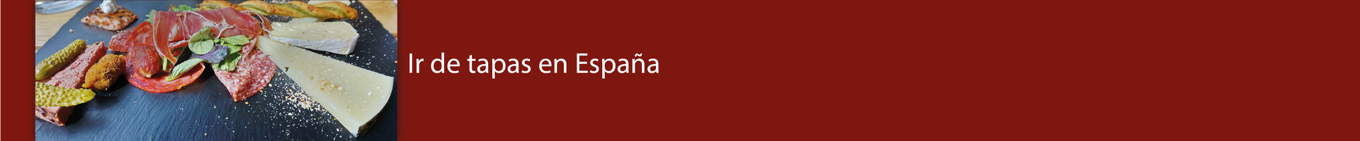 Ilustracja jest nagłówkiem tekstu z napisem: Ir de tapas en España. Z boku zdjęcie przedstawiające tapas - między innymi sery i wędliny.