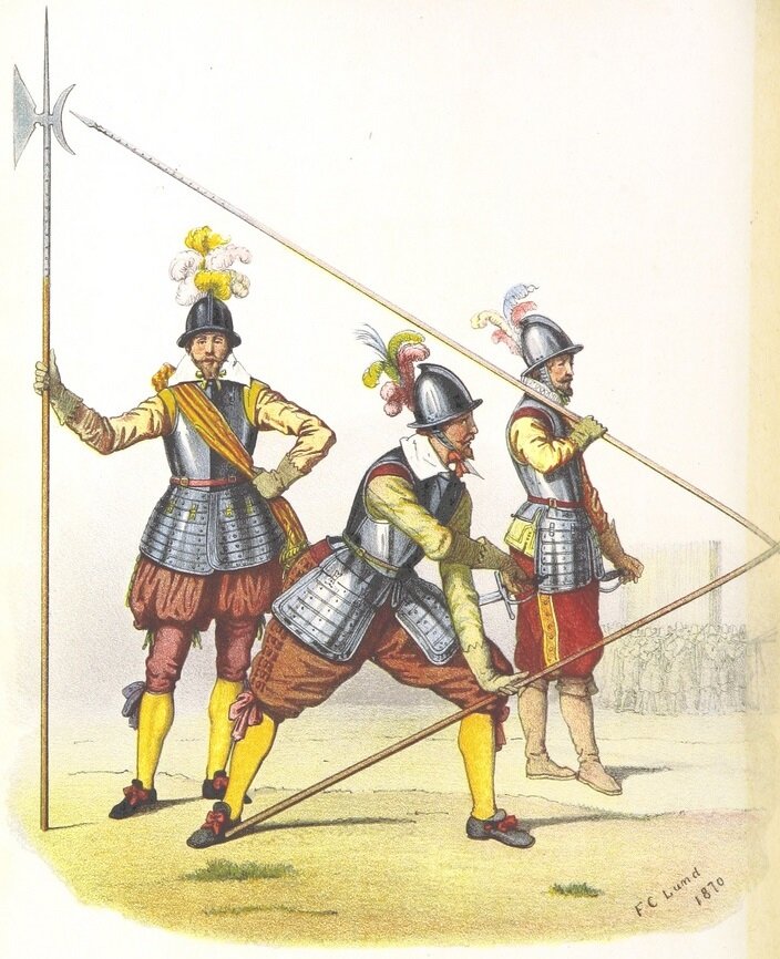 Ilustracja przedstawia pikinierów - dwóch żołnierzy i oficera z halabardą. Żołnierze trzymają długie piki. Wszyscy ubrani są w hełmy z piórami, zbroję zakrywającą torsy i biodra, bufiaste spodnie do kolan, żółte rajstopy, niskie buty (jeden z żołnierzy ma buty do kolan).