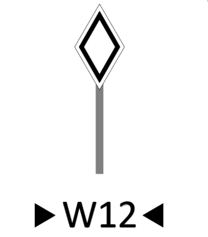 Wskaźnik wu dwanaście. Na szczycie słupka znajduje się znak w kształcie rombu. Jest biały i ma czarny kontur.