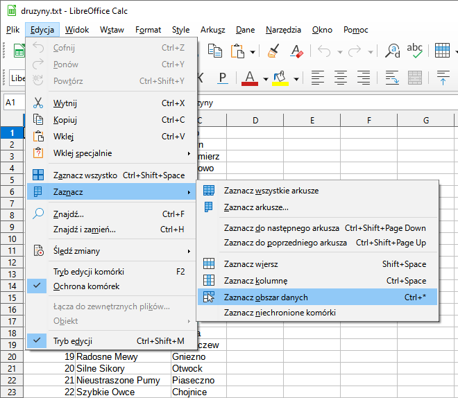 Zrzut ekranu przedstawia plik: druzyny.txt w programie LibreOffice Calc.  Kliknięto opcję: Edycja, następnie wybrano: zaznacz a następnie wybrano opcję: Zaznacz obszar danych.