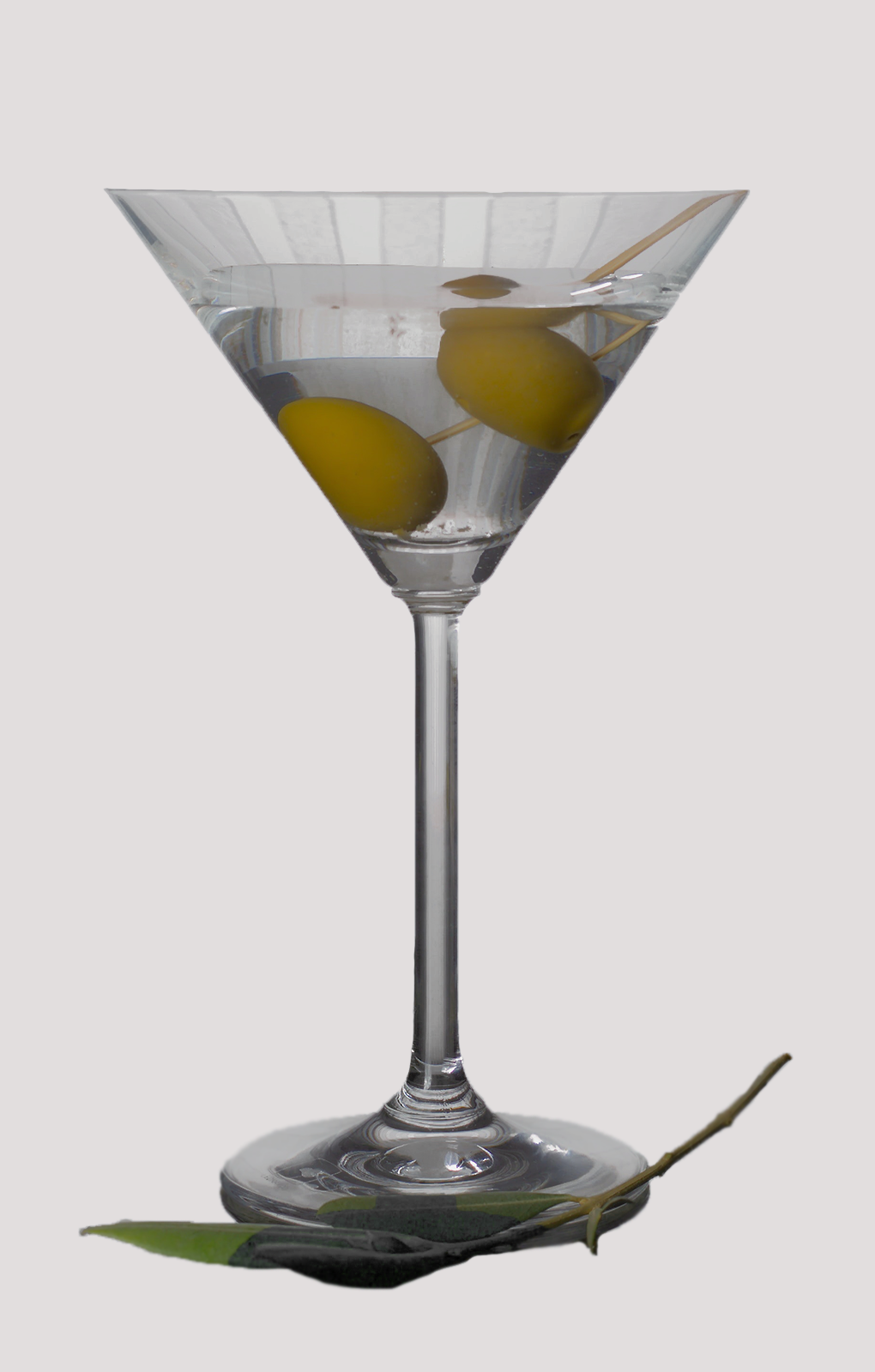 Zdjęcie przedstawia drink Dry Martini. Pod punktami interaktywnymi znajdują się nagrania audio prezentujące opis każdego drinka.