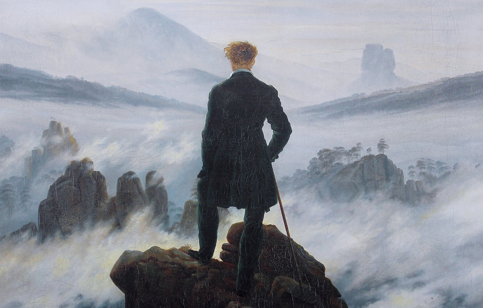 Wędrowiec nad morzem mgły [fragment] Źródło: Caspar David Friedrich, Wędrowiec nad morzem mgły [fragment], 1818, olej na płótnie, Hamburger Kunsthalle, Niemcy, domena publiczna.