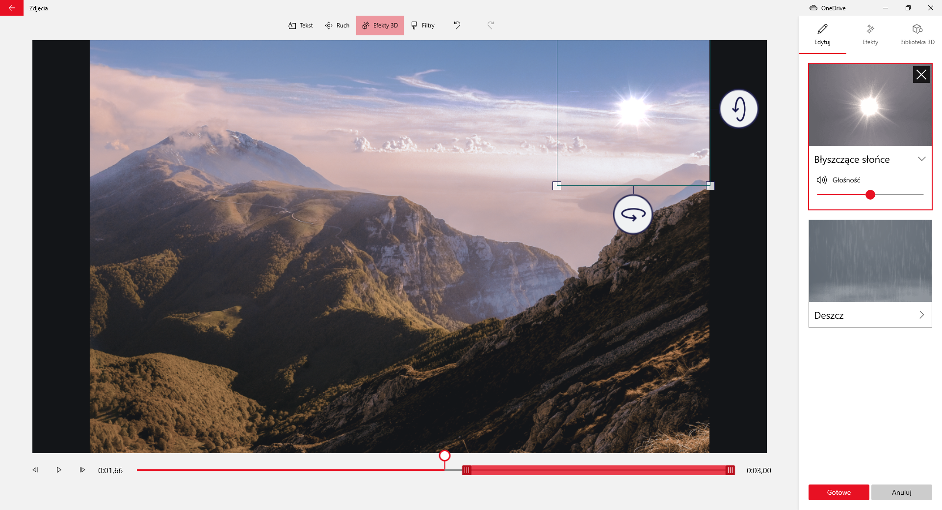  Na zrzucie ekranu przedstawiono sposób zastosowania efektów zdjęcia w aplikacji Edytor Wideo.W górnej części aplikacji znajduje się przycisk z symbolem strzałki skierowanej w lewo oraz napis: zdjęcia. Obok widoczne są przyciski: tekst, ruch, efekty trzy de, filtry. Przycisk efekty trzy de jest wciśnięty. Poniżej przycisków znajduje się okno edycji filmu. Główną cześć okna stanowi prostokątny obszar na którym wyświetlany jest film lub zdjęcie. Przykładowo jest to klatka filmowa na której widoczne są góry. W prawym górnym rogu zdjęcia  widoczne jest słońce. Słońce jest zaznaczone kwadratem. Poniżej dolnego i prawego bocznego boku kwadratu znajdują się symbole obracających się strzałek. Pod obszarem filmowym umieszczony jest suwak pokazujący czas trwania. Na suwaku jest okrągły znaczki czasu. Znacznik jest umieszczony w połowie czasu trwania filmu.Po lewej stronie suwaka znajduje się przycisk z narysowanym grotem strzałki skierowanym w lewo, przycisk play, przycisk z narysowanym grotem zwróconym w prawo oraz informacja o czasie trwania filmu. Z prawej strony suwaka widoczna jest informacja z czasem trwania filmu.Z prawej strony aplikacji znajduje się okno edycyjne efektów trzy de. W oknie efektów widoczna jest miniatura z zaznaczonymi obszarami. Pod pierwszą miniaturą znajduje się napis: błyszczące słońce. Pod napisem jest symbol głośnika oraz suwak głośności. Suwak jest ustawiony w połowie. Druga miniatura jest opisana słowem deszcz. Poniżej umieszczone są dwa przyciski. Czerwony z napisem: gotowe, oraz szary z napisem: anuluj.