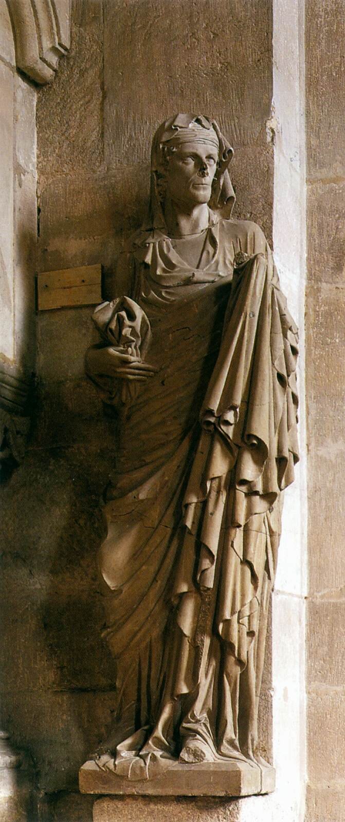 Ilustracja przedstawia postać Św. Elżbiety, jest to rzeźba w Katedrze Świętych Piotra i Jerzego w Bambergu. Kobieta w długiej szacie, patrząca w lewą stronę.