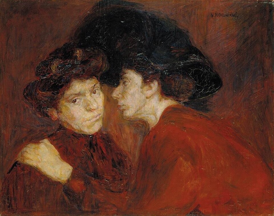 Obraz przedstawia dwie kobiety w średnim wieku, ujęte do piersi.  Noszą czerwone suknie. Czarne włosy mają upięte w koki. Jedna, po prawej stronie, trzyma drugą za ramię i nachyla się do jej ucha, jakby chciała coś przekazać. Druga patrzy na widza ze zniecierpliwieniem. Tło jest ciemne.