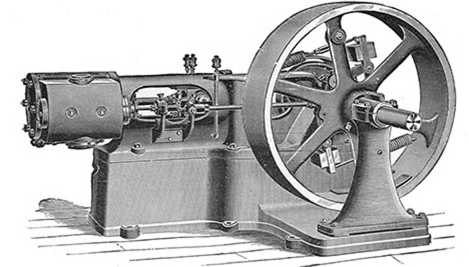 Rycina pokazuje metalową maszynę ustawioną na masywnej podstawie. Po prawej stronie dominuje duże koło zamachowe osadzone na wale i wsporniku. W części środkowej widać elementy mechanizmu przeniesienia ruchu (pręty, dźwignie). Po lewej znajduje się obudowany zespół napędowy z widocznymi przyłączami i osprzętem.