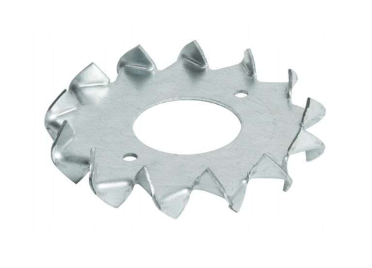 Zdjęcie przedstawia metalowy pierścień zębaty z trzema otworami. Jeden z nich jest większy, a dwa niewielkie. 