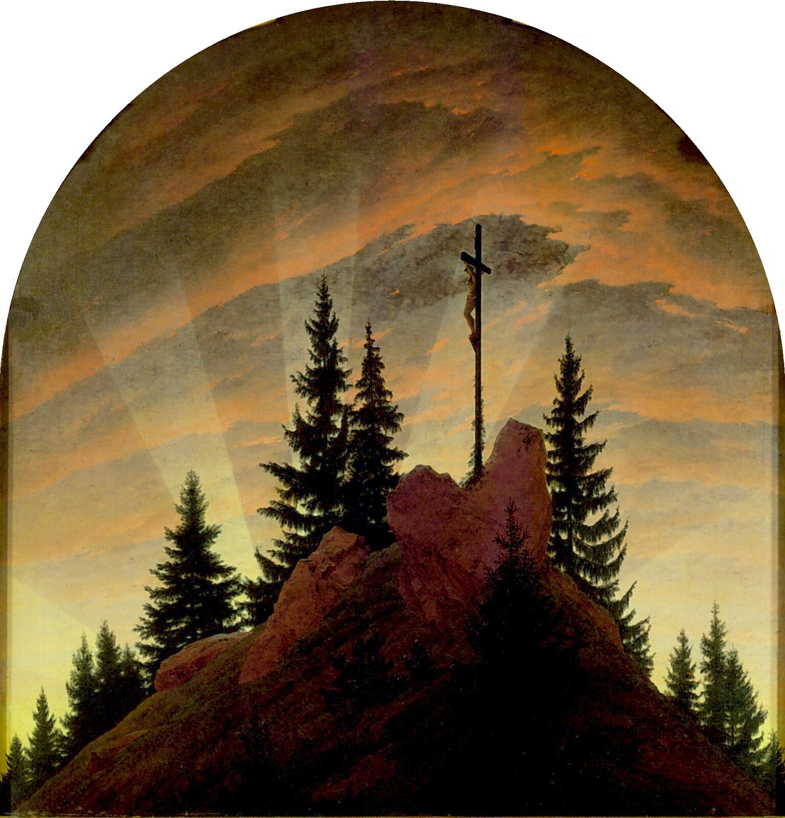 Obraz autorstwa Caspar David Friedrich pod tytułem „Krzyż w górach” przedstawia górę porośniętą drzewami. Na szczycie góry znajduje się krzyż, na którym znajduje się przywiązany do niego mężczyzna. Zza drzew wydobywa się światło, którego blask oświetla niebo. W górnej części obrazka znajdują się chmury.