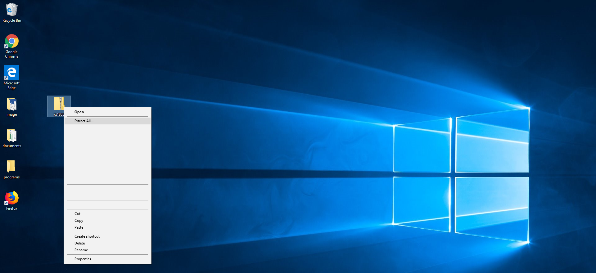 Zrzut ekranu przedstawia rozpakowywanie archiwum zip. Widoczny jest pulpit Windows 10 z kilkoma przypadkowymi ikonami. Zaznaczona jest ikona archiwum zip, obok menu podręczne z opcjami miedzy innymi Open, Extract All...