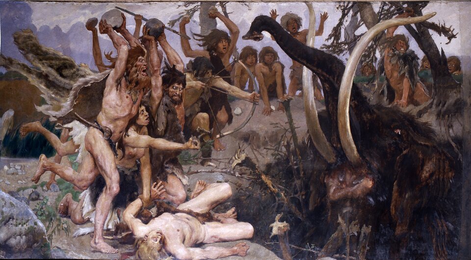 Ilustracja przedstawia obraz Viktora Vasnetsova, "Epoka kamienia", ukazujący scenę polowania ludzi pierwotnych na mamuta. Na pierwszym planie znajduje się grupa ludzi odzianych w skóry zwierzęce, atakujących włochatego mamuta znajdującego się po prawej stronie. Mamut ma długie, zakrzywione kły oraz zadartą do góry trąbę. Od lewej strony pędzi grupa osób  celujących w niego kamieniami. Z grupy wysuwa się potężny mężczyzna z brodą i rozwianymi włosami, który unosi nad głowę wielki kamień, kierując go ku mamutowi. Na jego twarzy rysuje się gniew, a ciało ma napięte od wysiłku. Nieco dalej kolejny wojownik naciąga łuk, celując w zwierzę. Jego ciało jest smukłe, a twarz skupiona, z wyrazem pełnym determinacji. U dołu leży  na wpół nieżywy mężczyzna, którego jedną rękę podtrzymuje kobieta.  Jego twarz przepełniona jest strachem lub cierpieniem, a ciało napięte. Z tyłu scenie przyglądają się  młodzieńcy, niektórzy z nich wymachują rękoma. Tło wypełniają konary drzew, przez które prześwituje fioletowawe, niebo.