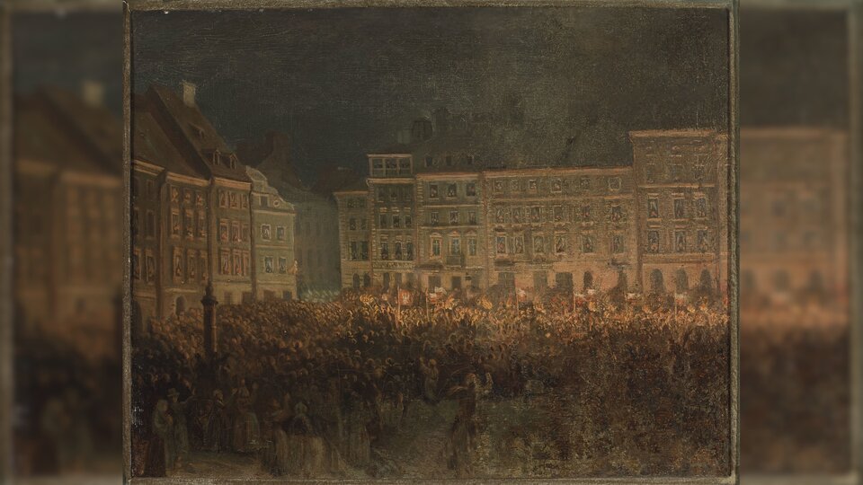 Obraz przedstawia nocny widok na rynek miasta, na którym zgromadziły się tłumy ludzi. W tle znajdują się kamienice.