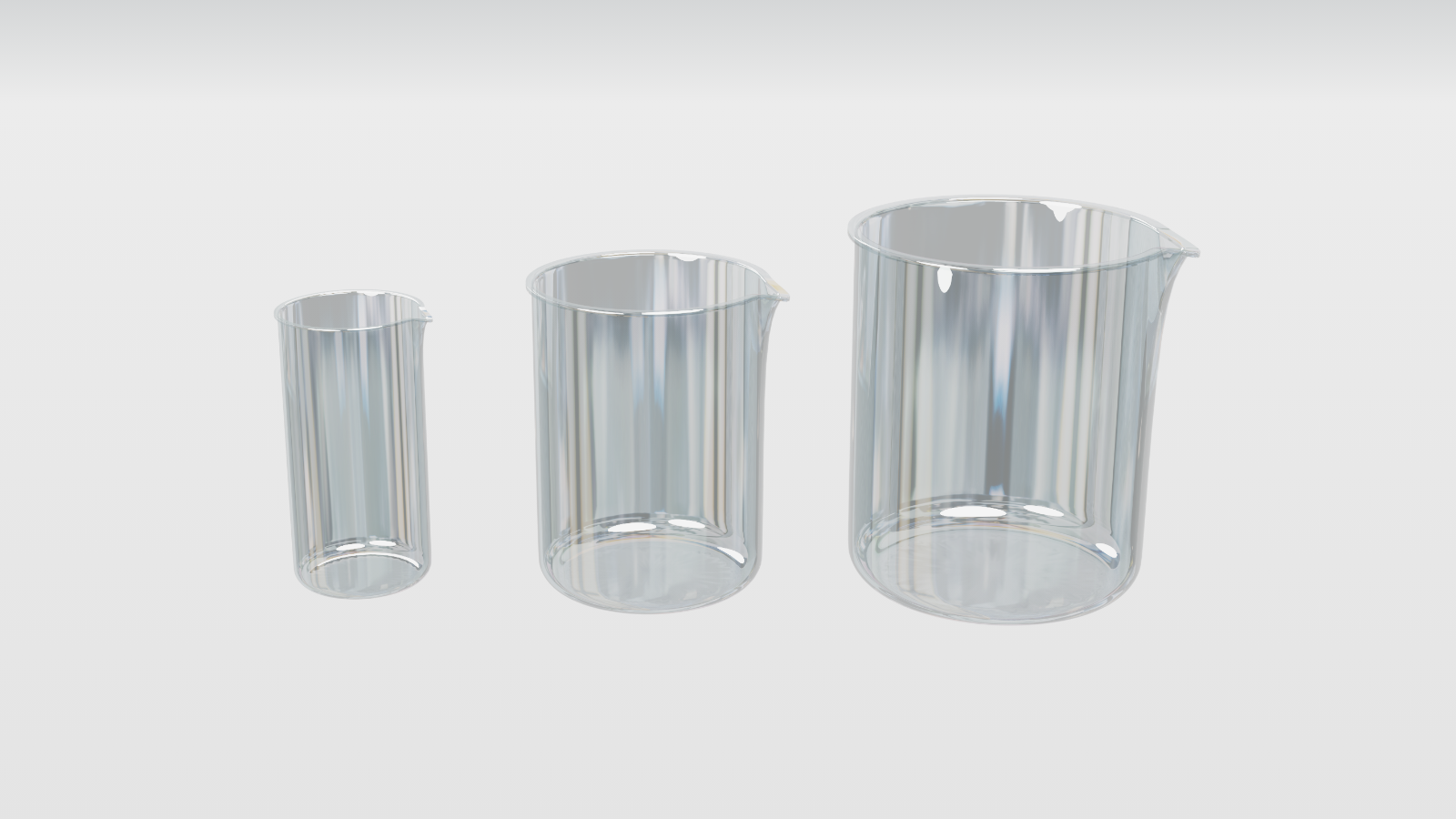 Na zdjęciu przedstawione są trzy zlewki różnych rozmiarów.