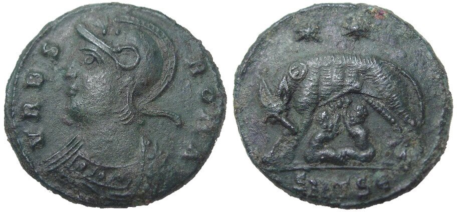 Zdjęcie przedstawia awers i rewers starożytnej, rzymskiej monety. Na awersie widoczny jest profil mężczyzny w wojskowym hełmie. Na rewersie widać wilczycę karmiącą dwoje bliźniąt. Na monecie nie ma nazwy miasta, ani państwa.
