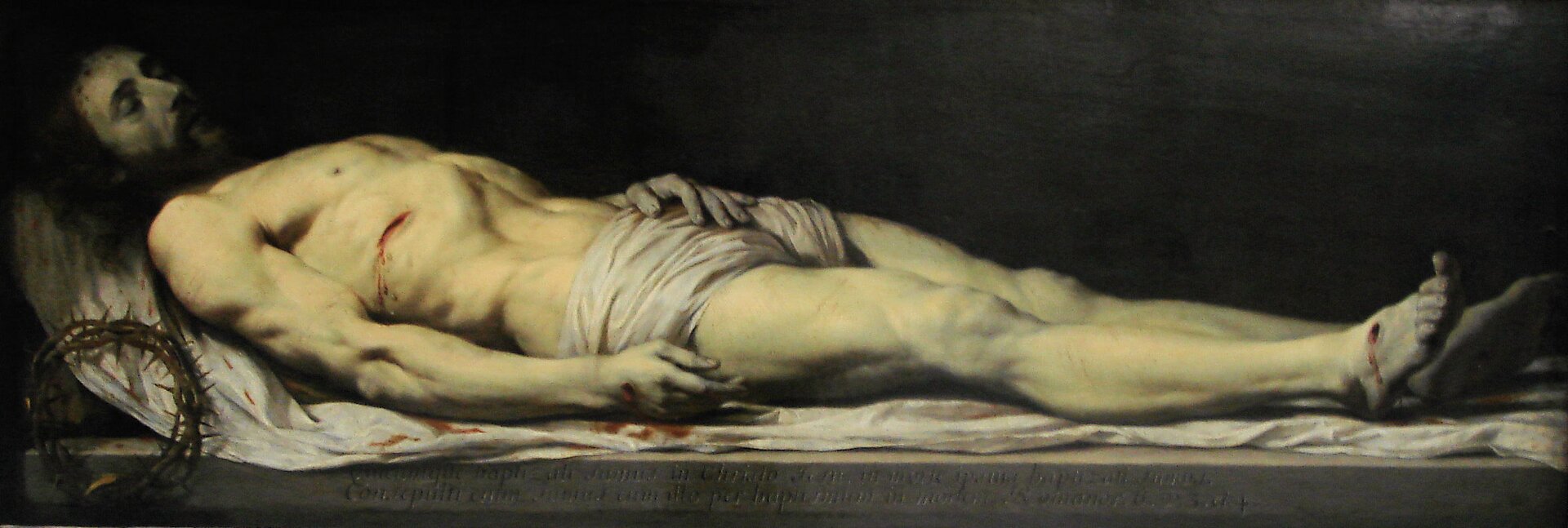 Ilustracja przedstawia obraz Philippe de Champaigne „Martwy Chrystus złożony na całunie”. Na obrazie znajduje się martwy Chrystus. Mężczyzna jest półnagi, w pasie ma jedynie kawałek materiału. Postać leży na białym płótnie. Widoczne są rany na jego dłoniach oraz stopach, z których wypływa krew. Po lewej stronie obrazu znajduje się korona cierniowa.
