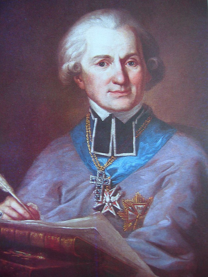 Obraz przedstawia portret dojrzałego mężczyzny. Jego twarz jest owalna, z wyraźnie zaznaczonymi brwiami i wydatnym nosem. Mężczyzna ma długie, starannie ufryzowane włosy, nad uszami zawinięte w loki. Jest ubrany w biskupi strój, na jego szyi wisi szeroka szarfa z medalem z białym orłem. Mężczyzna ma także na szyi duży, wysadzany kamieniami krzyż. Na lewej piersi ma przypięty kolejny order. W prawej ręce trzyma gęsie pióro.