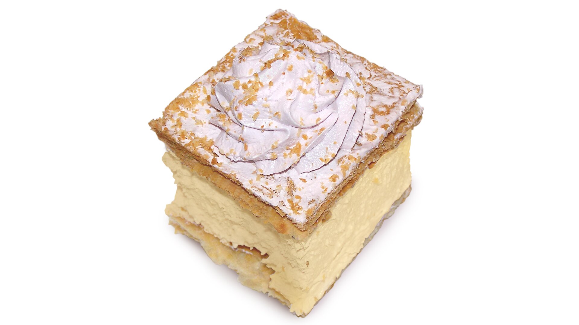 Kostka ciasta, masa ma kolor kremowy, na górze znajduje się lukier oraz posypka.