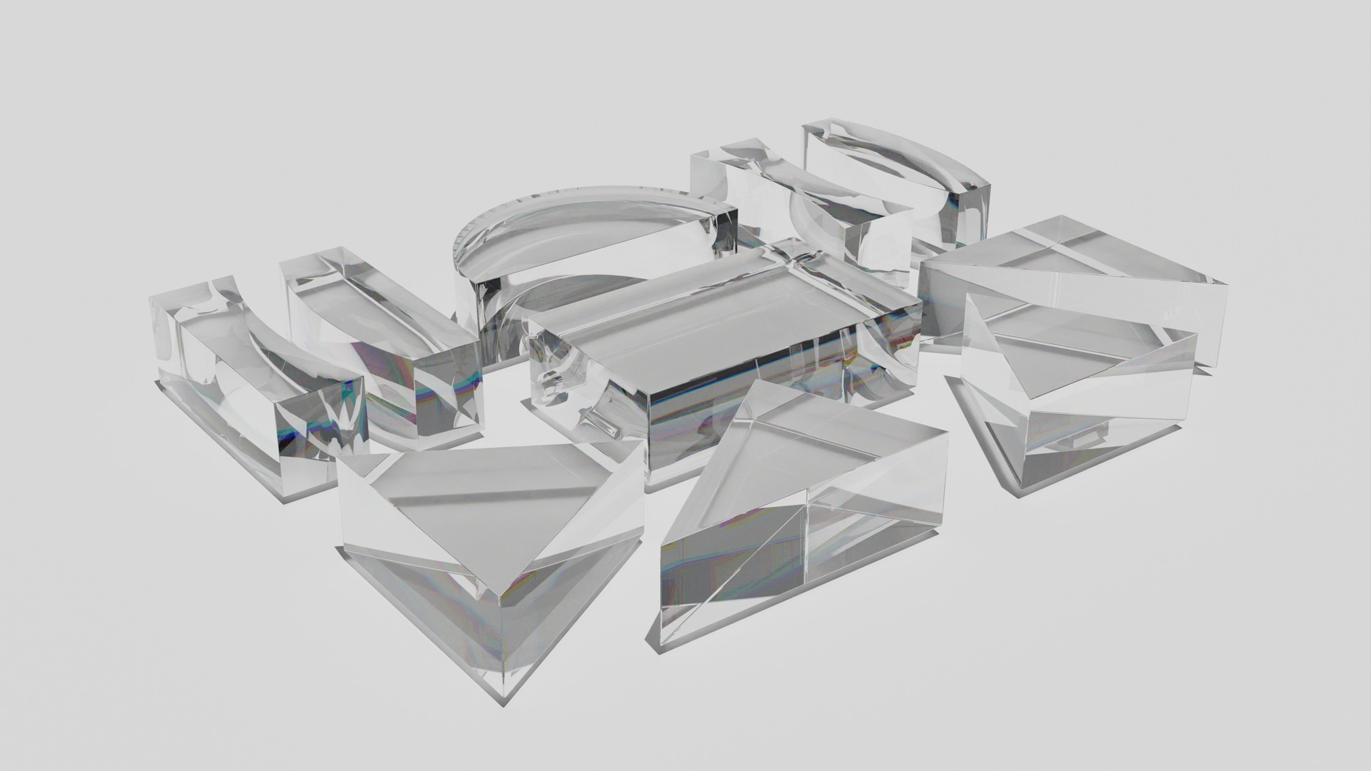 Na grafice przedstawiono zestaw pryzmatów o różnym kształcie: trójkątnym, półkolistym, podłużnym i tak dalej.